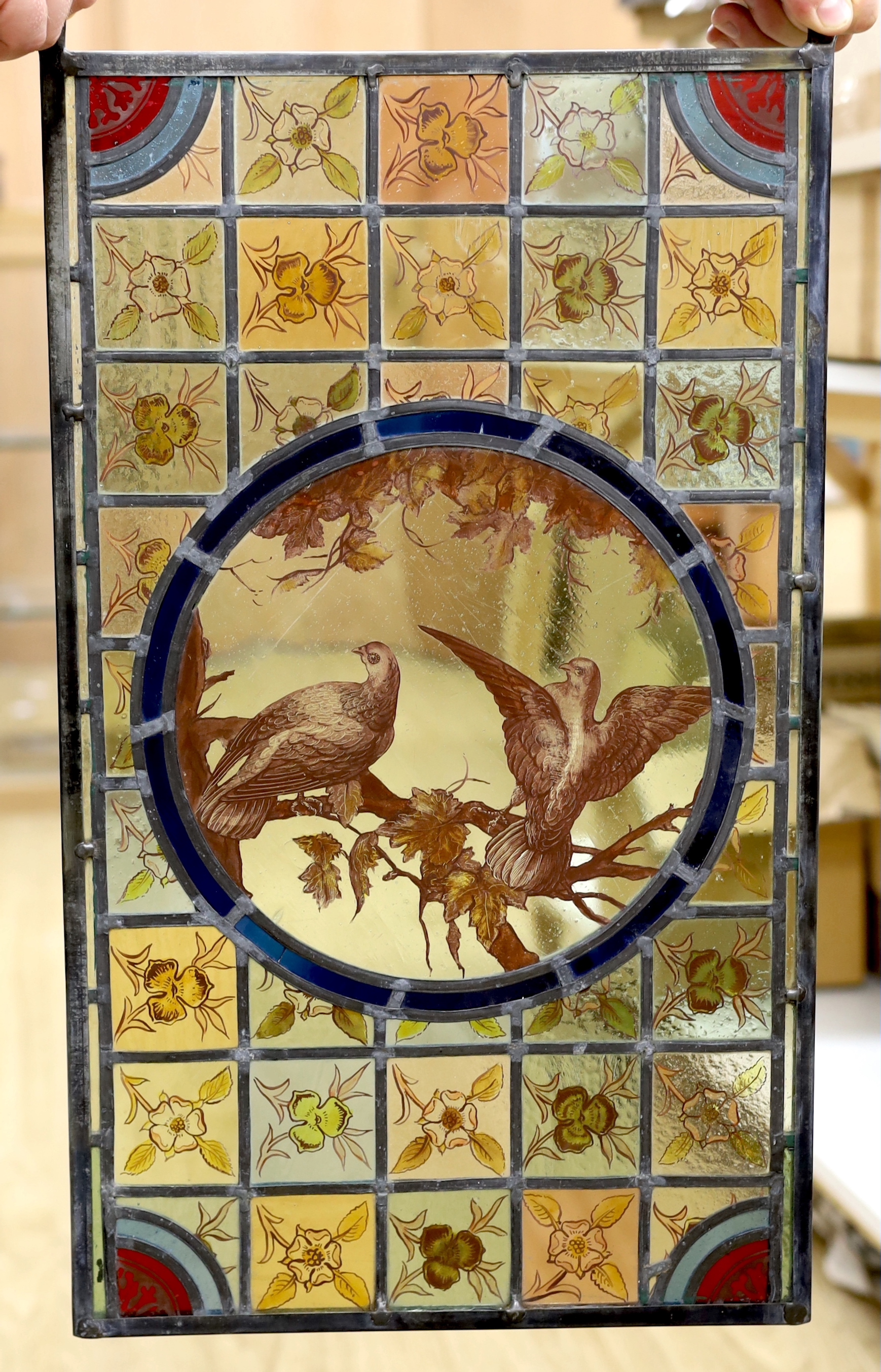 A Victorian 'two birds’ stained glass panel, 35cm wide x 59.5cm high